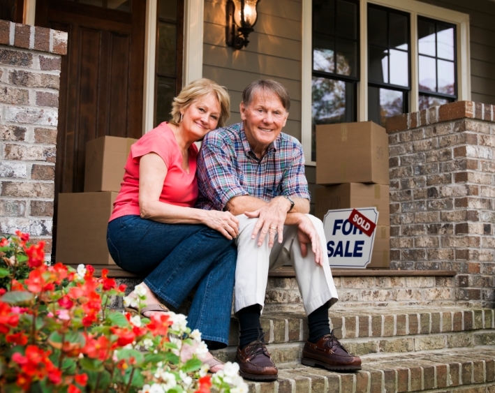 older couple outside of house