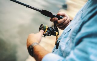 man holding fishing rod