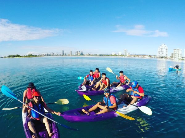 a family kayaking in the golden coast