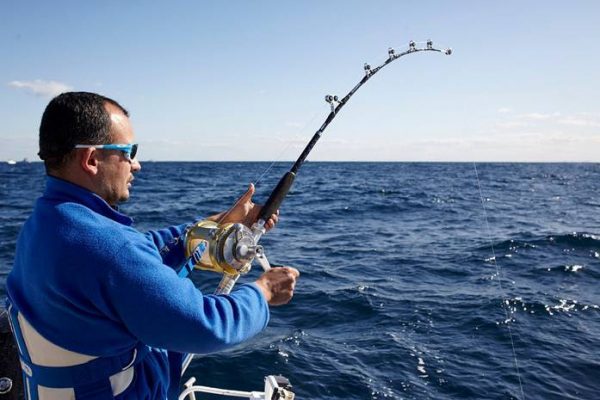 a man fishing in the ocean