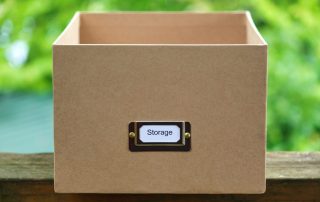 Green Background and box with no top on with the words Storage