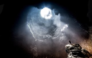 a photos of a person in a cave